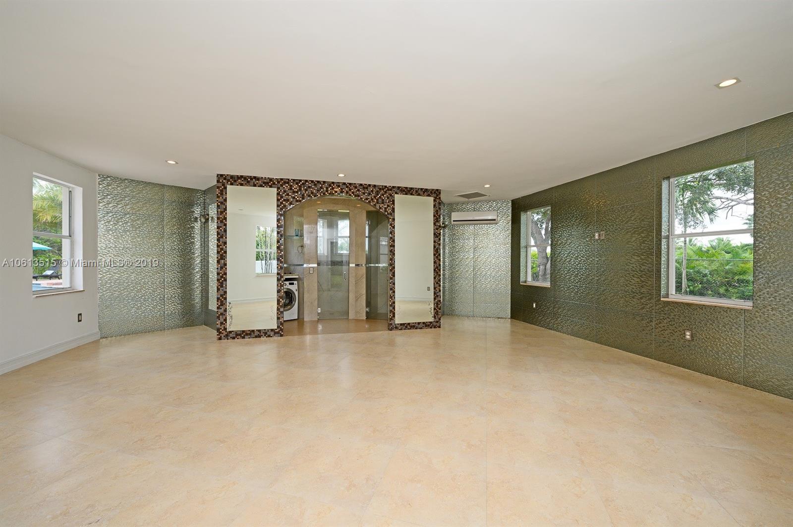 561 Ranch Road Weston, FL 33326 - Photo 37 of 46 an empty room with windows and closet