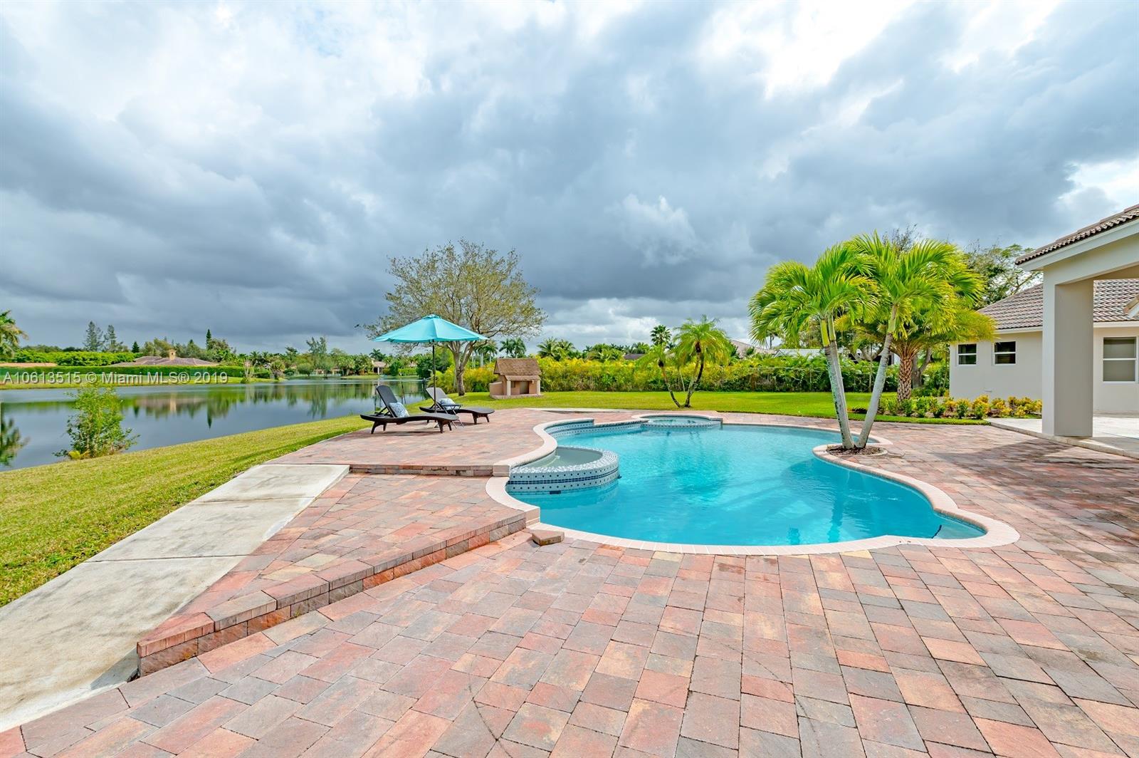 561 Ranch Road Weston, FL 33326 - Photo 39 of 46 a view of a garden with houses