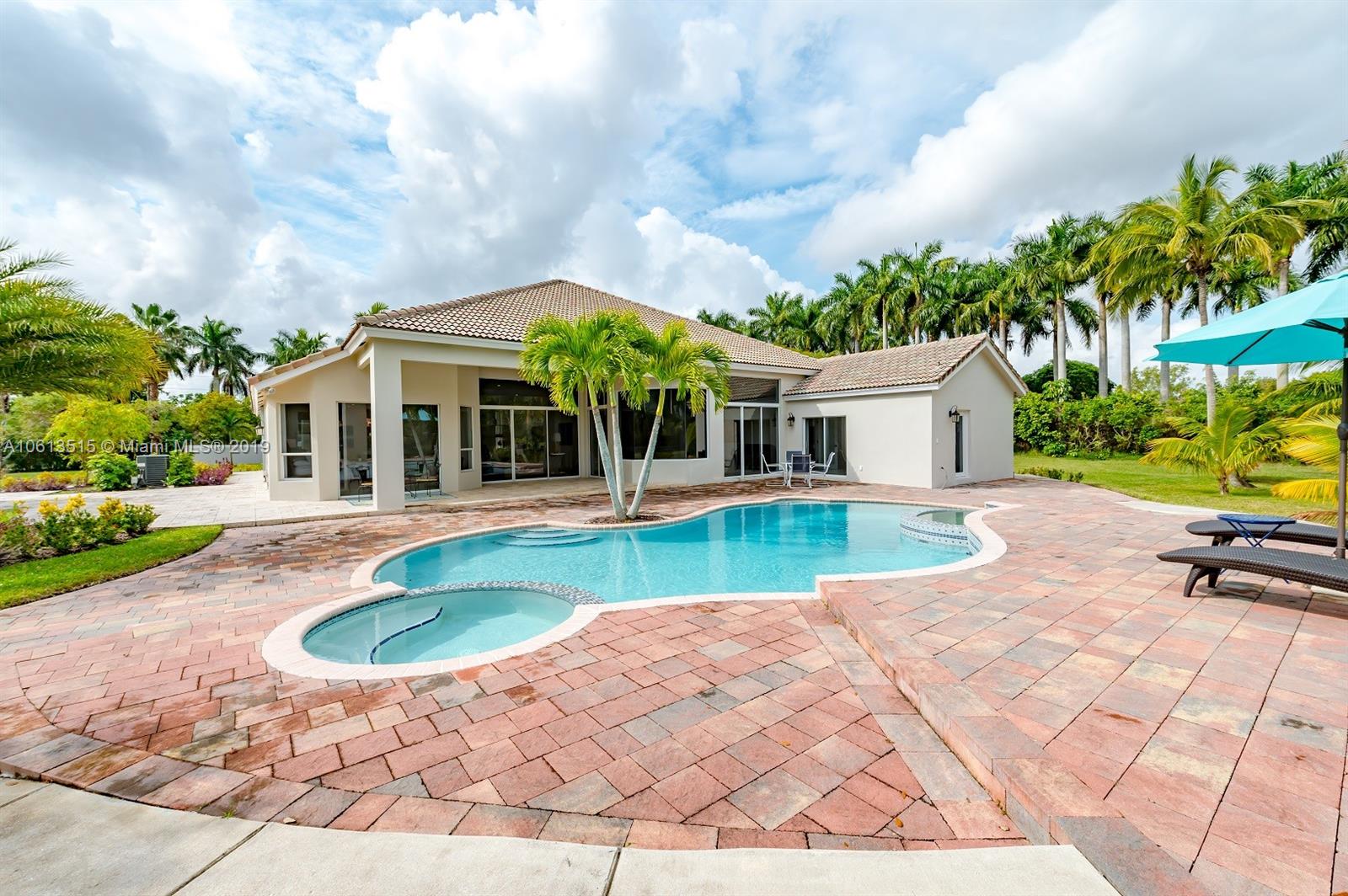 561 Ranch Road Weston, FL 33326 - Photo 40 of 46 a view of house with swimming pool outdoor seating