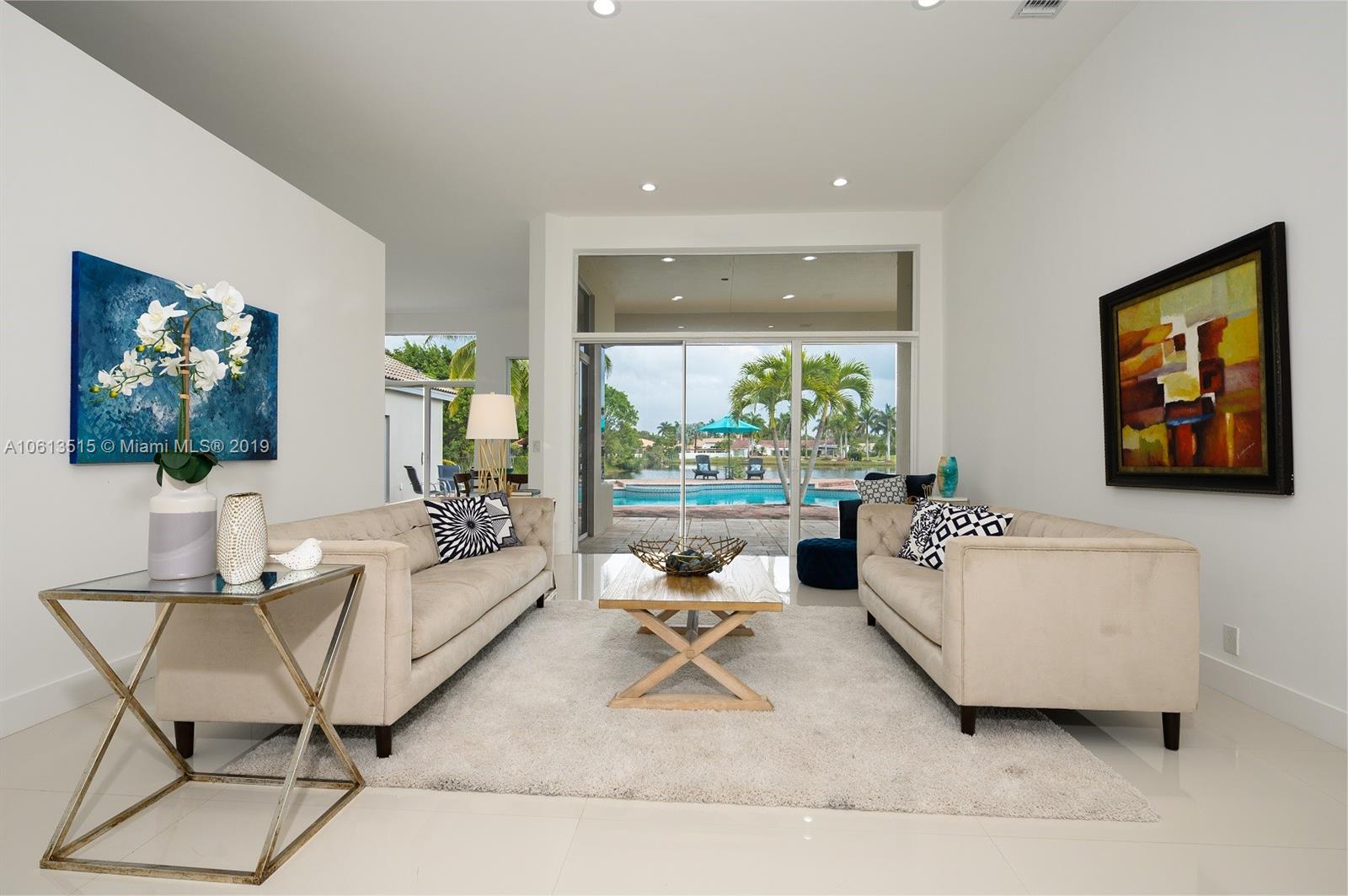561 Ranch Road Weston, FL 33326 - Photo 4 of 46 a living room with furniture and a large window