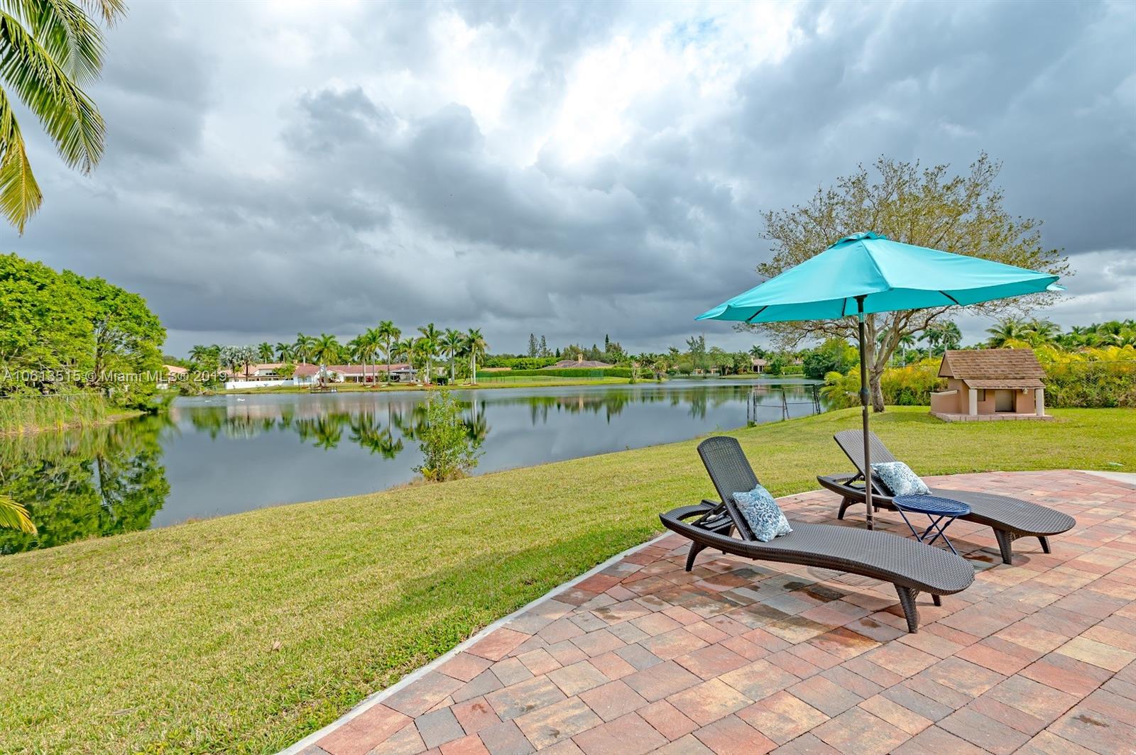 561 Ranch Road Weston, FL 33326 - Photo 41 of 46 a view of a garden with sitting area