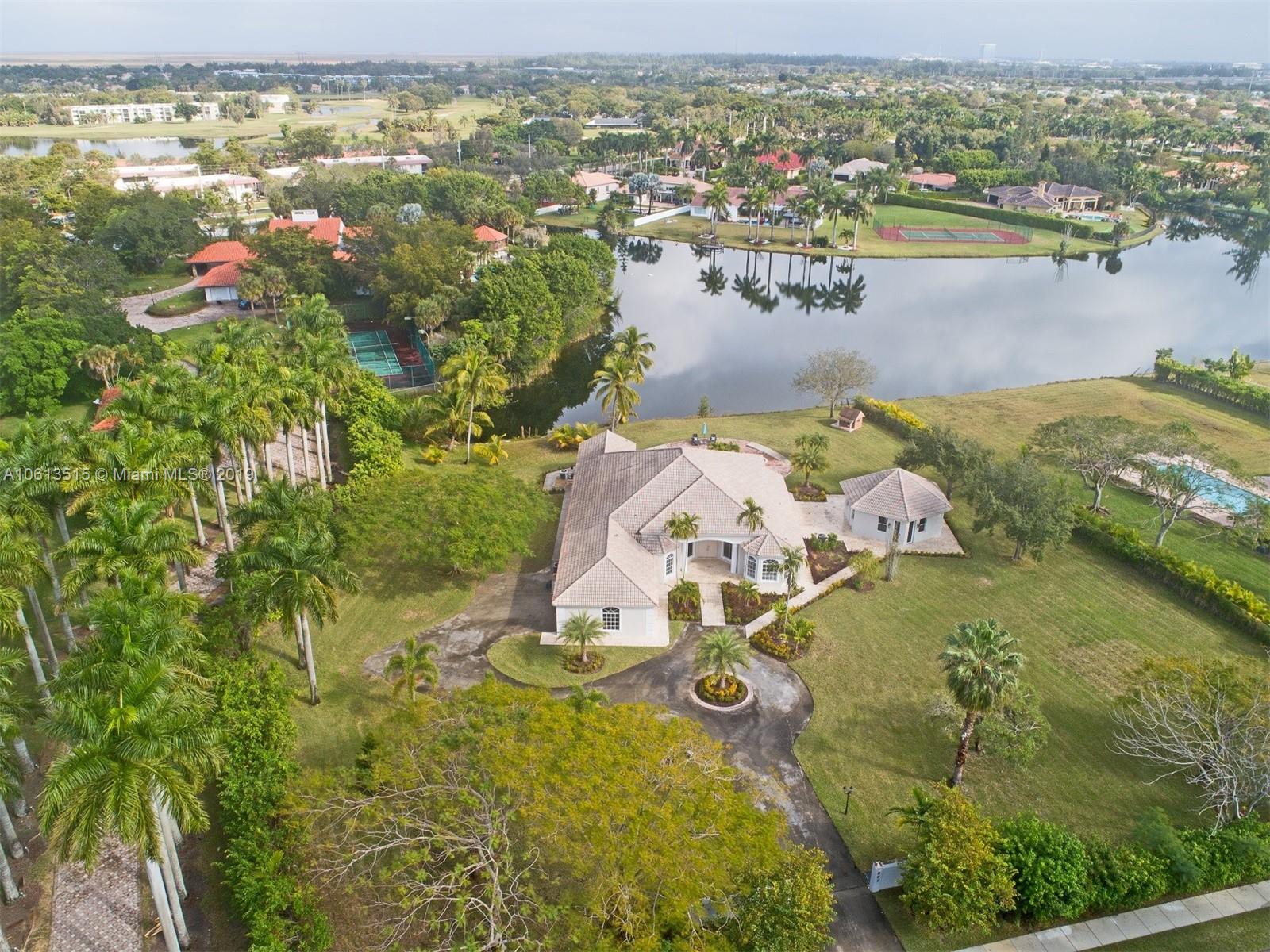 561 Ranch Road Weston, FL 33326 - Photo 43 of 46 an aerial view of residential houses with outdoor space