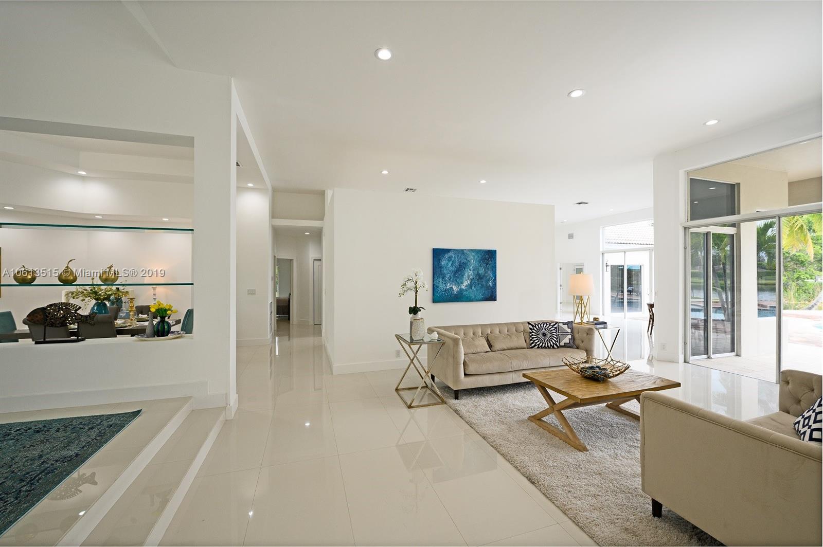 561 Ranch Road Weston, FL 33326 - Photo 5 of 46 a living room with furniture and a table