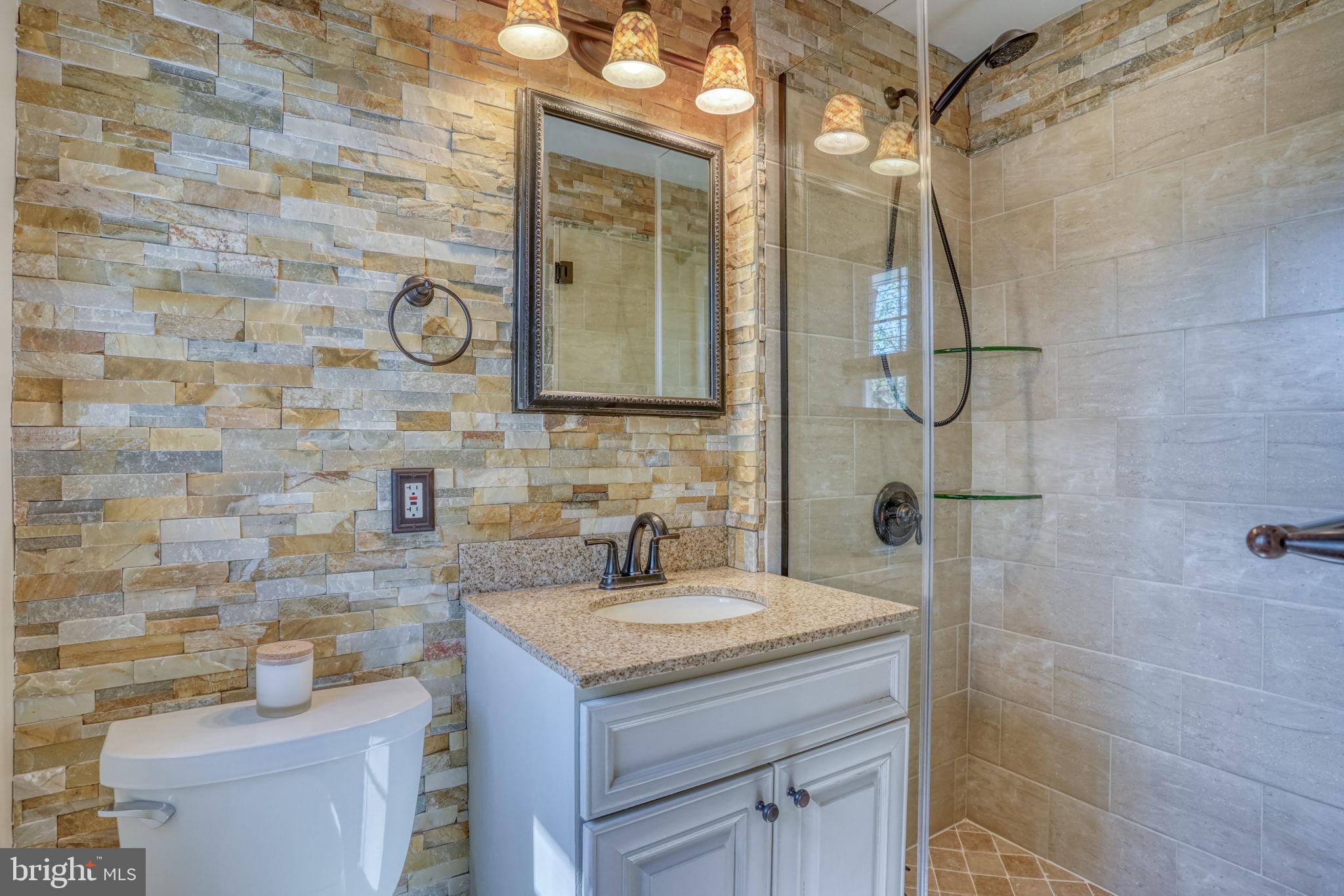 604 Ivydale Road Wilmington, DE 19803 - Photo 23 of 35 Updated bathroom with stone accents.