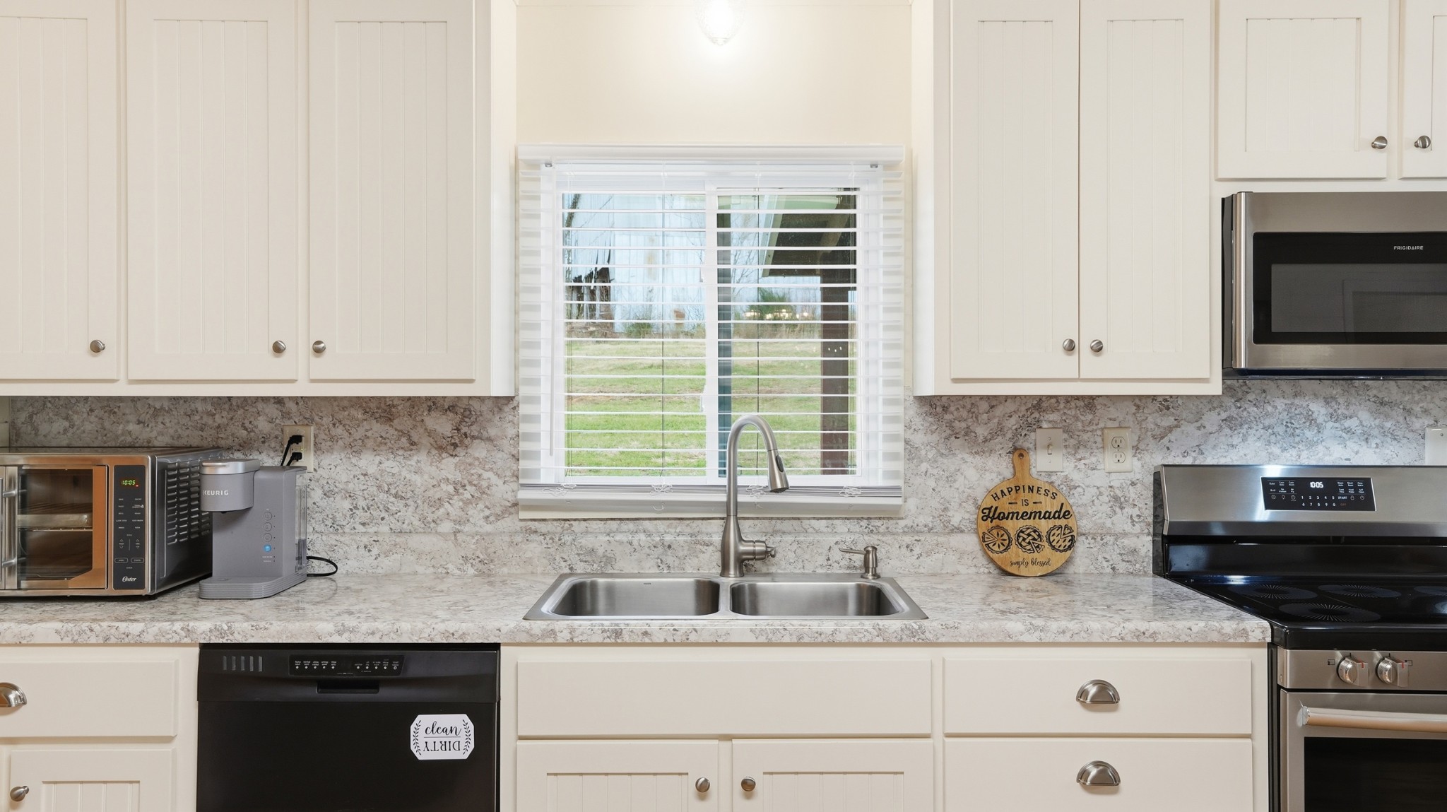 1101 Bagley Hollow Road Fayetteville, TN 37334 - Photo 28 of 52 a kitchen with granite countertop white cabinets and a sink