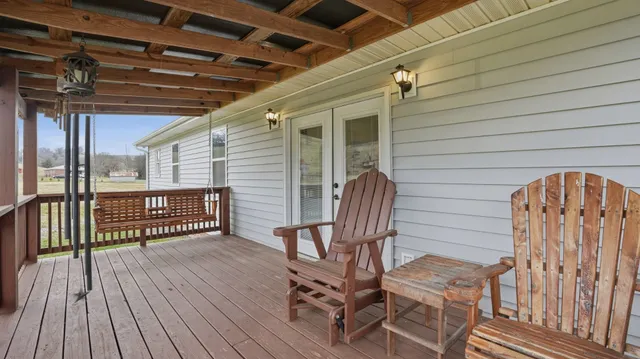 a view of porch with wooden floor