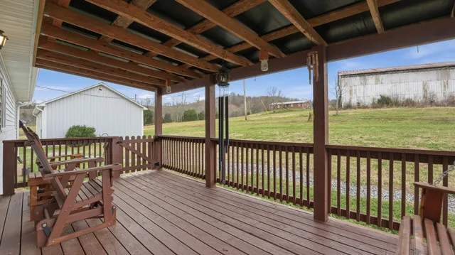 a view of a backyard with table and chairs