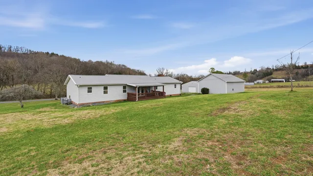 a view of a house with a big yard