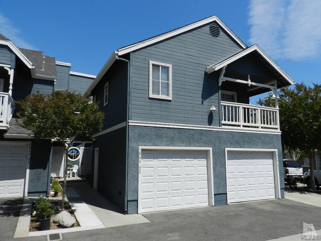 1866 Rory Lane, Unit 2 Simi Valley, CA 93063 - Photo 1 of 31 a front view of a house with a yard