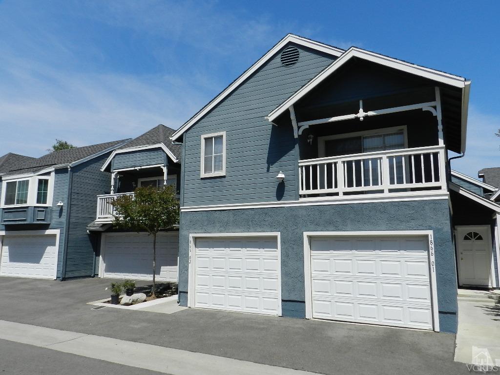 1866 Rory Lane, Unit 2 Simi Valley, CA 93063 - Photo 2 of 31 a front view of a house with garage