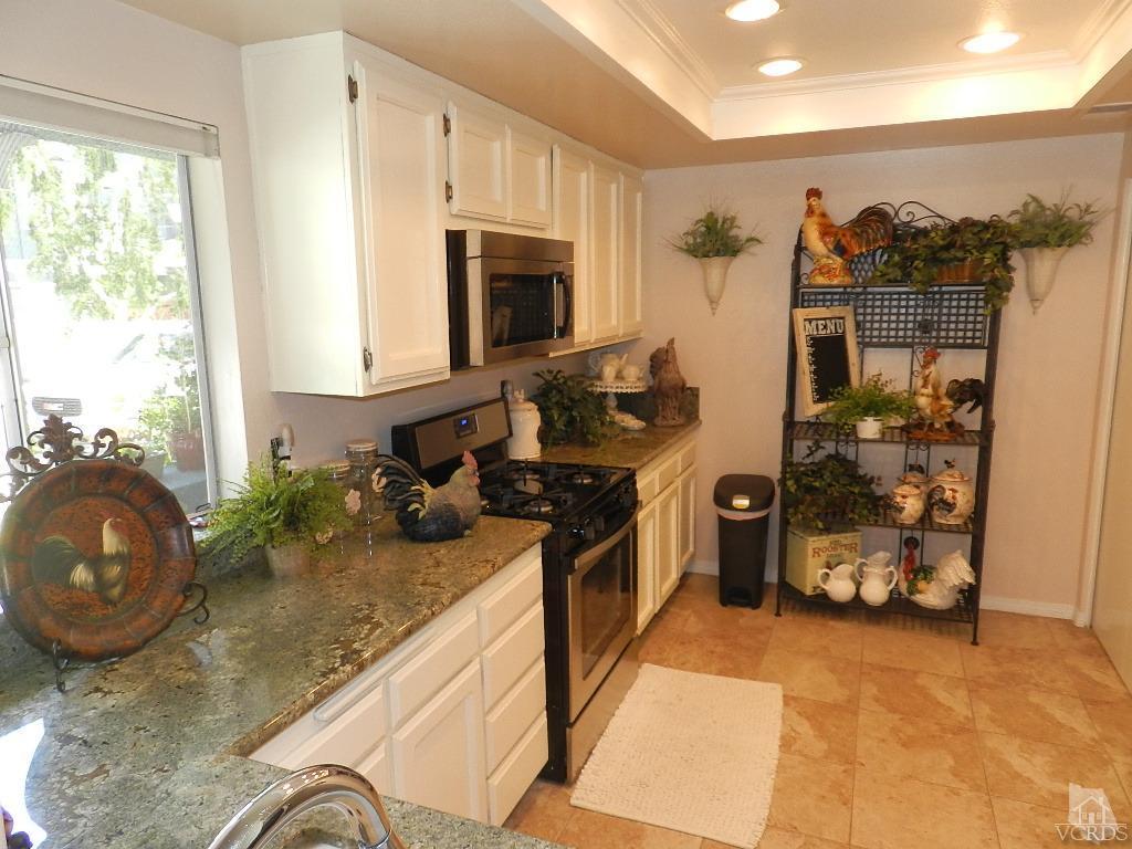 1866 Rory Lane, Unit 2 Simi Valley, CA 93063 - Photo 16 of 31 a kitchen with sink refrigerator and stove