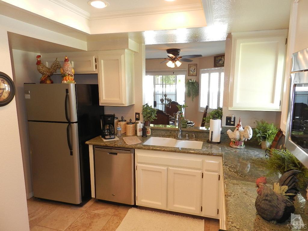 1866 Rory Lane, Unit 2 Simi Valley, CA 93063 - Photo 18 of 31 a kitchen with a sink refrigerator and cabinets
