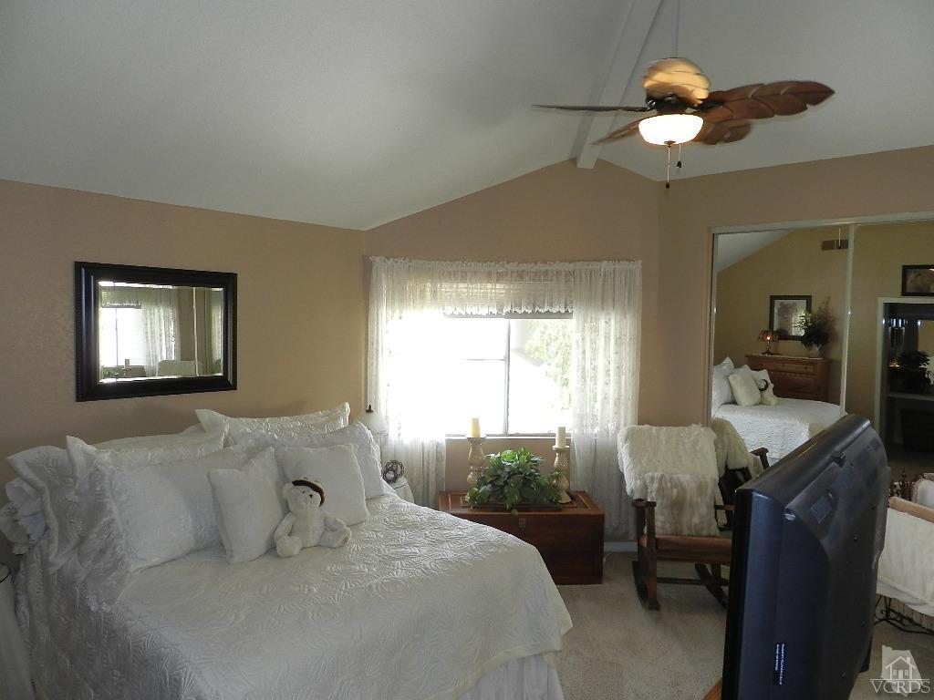 1866 Rory Lane, Unit 2 Simi Valley, CA 93063 - Photo 22 of 31 a living room with furniture chandelier and a window