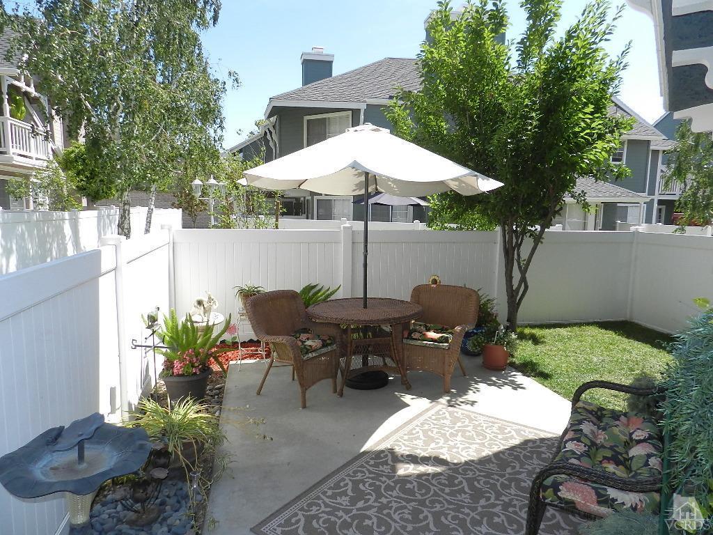 1866 Rory Lane, Unit 2 Simi Valley, CA 93063 - Photo 27 of 31 a view of a patio with table and chairs potted plants