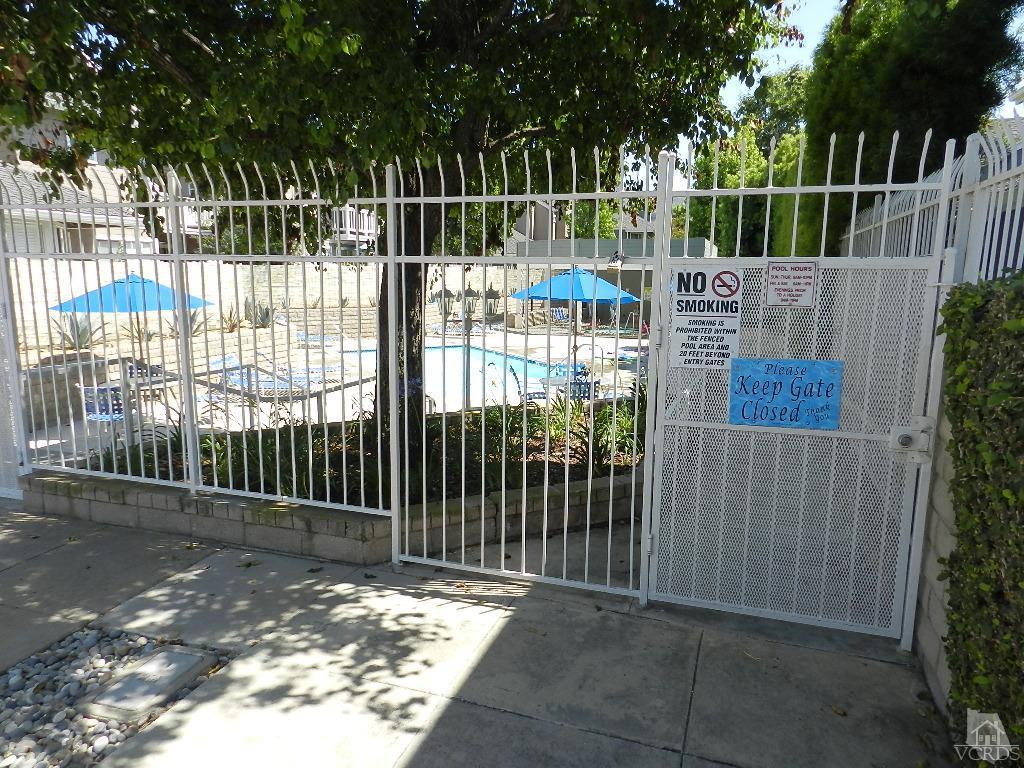 1866 Rory Lane, Unit 2 Simi Valley, CA 93063 - Photo 30 of 31 a view of a gate with a fence