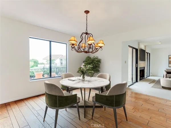 a kitchen with stainless steel appliances kitchen island granite countertop a refrigerator and a stove top oven