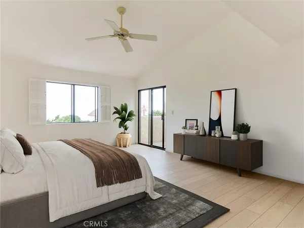 a bedroom with a bed and painting on the wall