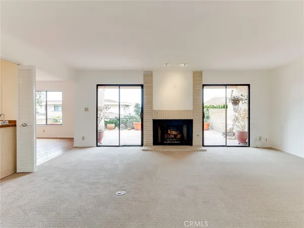 a view of an empty room with windows