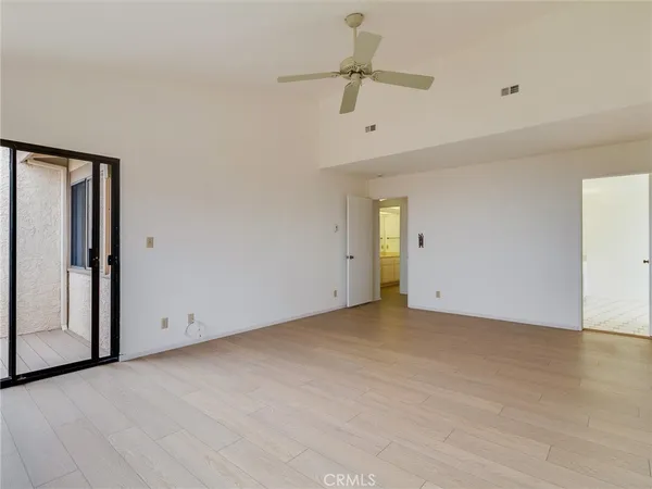 a bathroom with a bathtub and next to a window