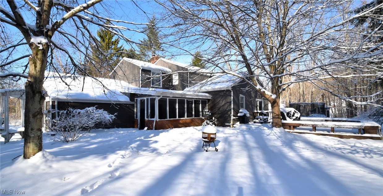 11801 Heath Road Chesterland, OH 44026 - Photo 19 of 21 Snowy yard with a screened in porch