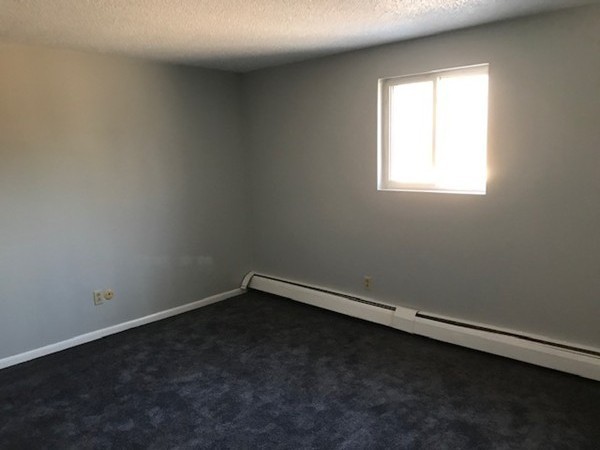 135 Creek Street, Unit 9 Wrentham, MA 02093 - Photo 11 of 15 an empty room with a window
