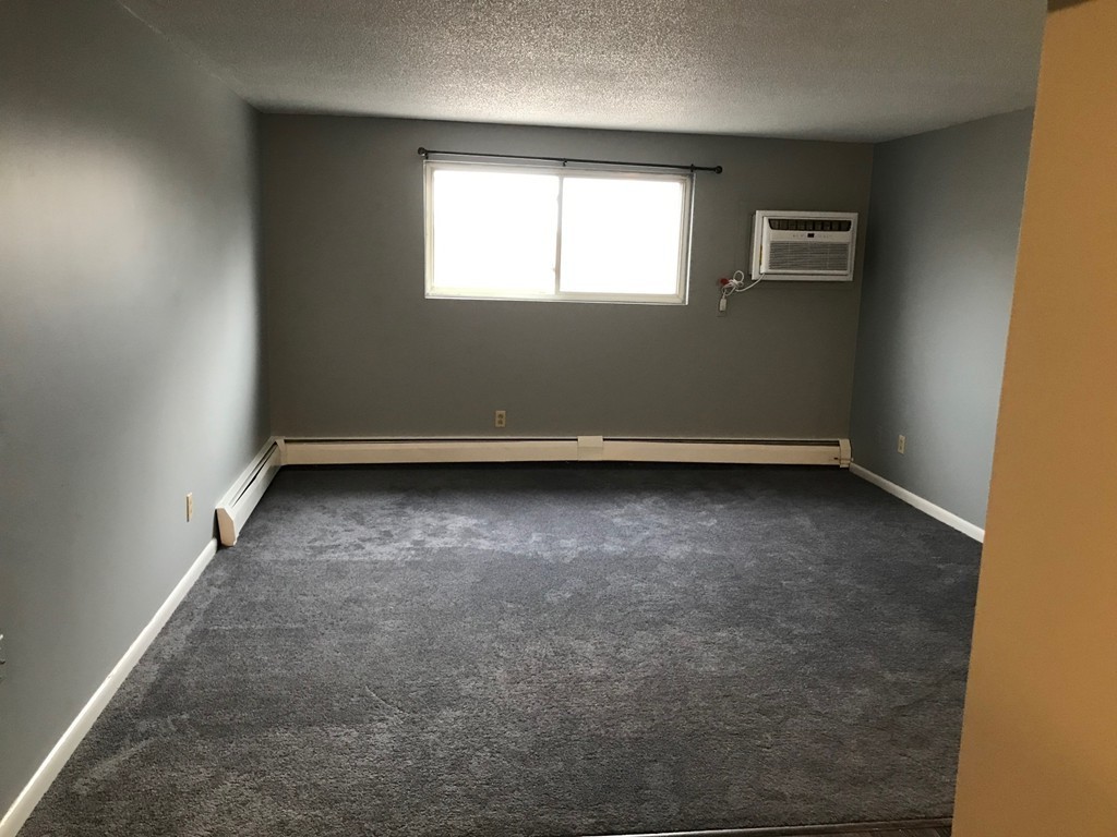 135 Creek Street, Unit 9 Wrentham, MA 02093 - Photo 15 of 15 an empty room with a window