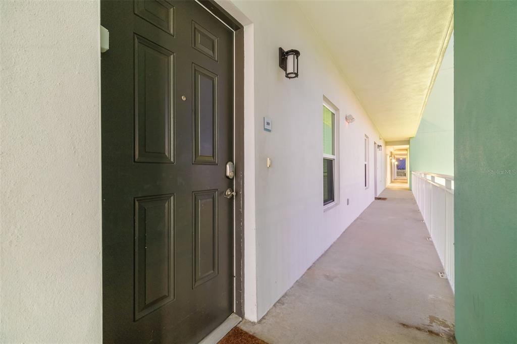 15305 1st Street East, Unit 201 Madeira Beach, FL 33708 - Photo 13 of 41 a view of a hallway with entryway