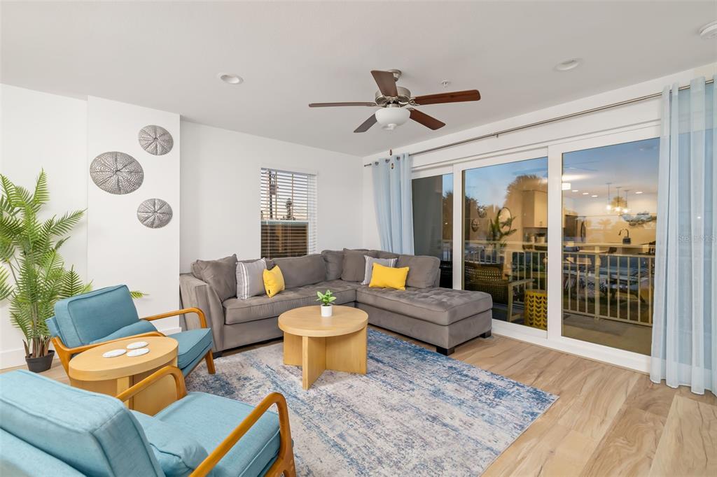 15305 1st Street East, Unit 201 Madeira Beach, FL 33708 - Photo 18 of 41 a living room with furniture and a rug