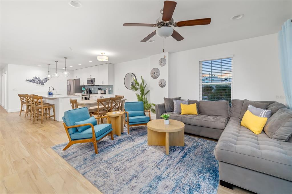 15305 1st Street East, Unit 201 Madeira Beach, FL 33708 - Photo 22 of 41 a living room with furniture and wooden floor