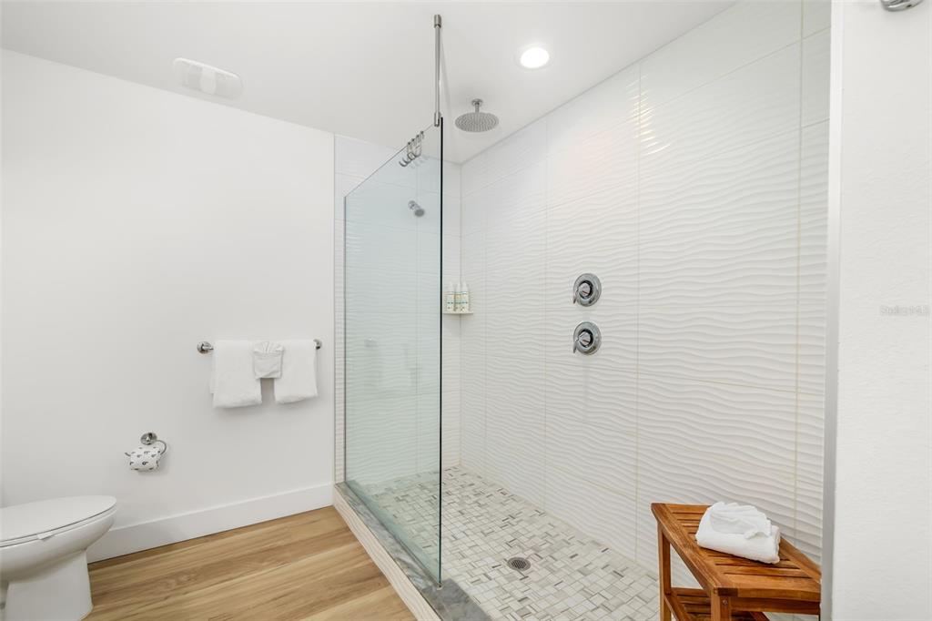 15305 1st Street East, Unit 201 Madeira Beach, FL 33708 - Photo 28 of 41 a bathroom with a shower