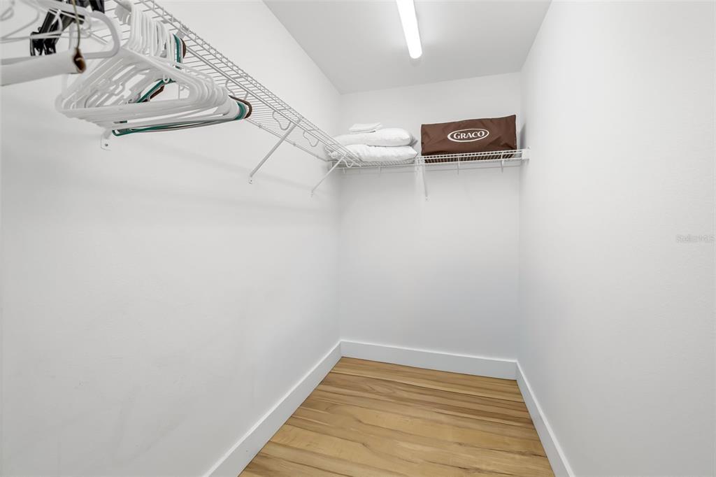 15305 1st Street East, Unit 201 Madeira Beach, FL 33708 - Photo 29 of 41 a view of a room with rack on the wall