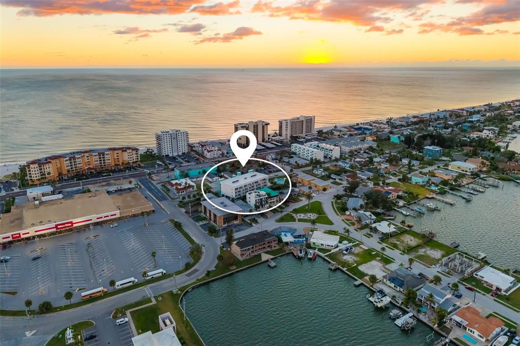 15305 1st Street East, Unit 201 Madeira Beach, FL 33708 - Photo 3 of 41 a view of a city with an ocean view