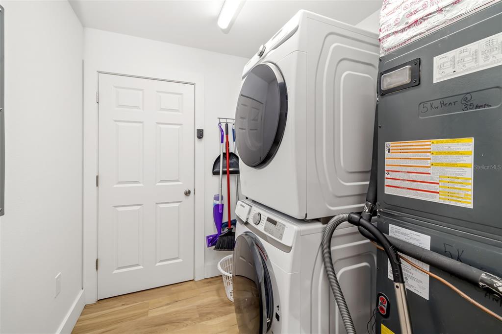 15305 1st Street East, Unit 201 Madeira Beach, FL 33708 - Photo 37 of 41 a view of walk in closet with clothes and shoes