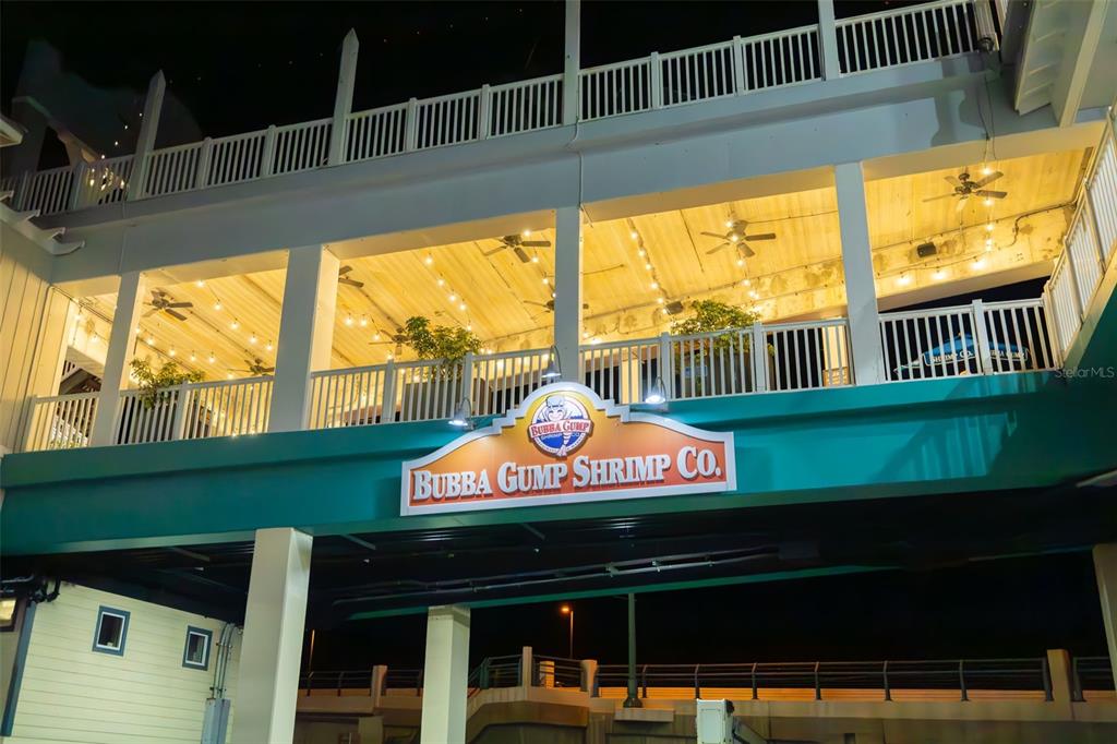 15305 1st Street East, Unit 201 Madeira Beach, FL 33708 - Photo 40 of 41 a front view of a house with a garden