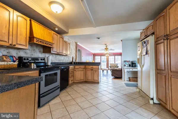 a kitchen with cabinets and stainless steel appliances