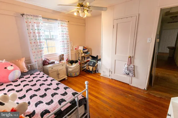 a bedroom with furniture and a flat tv screen