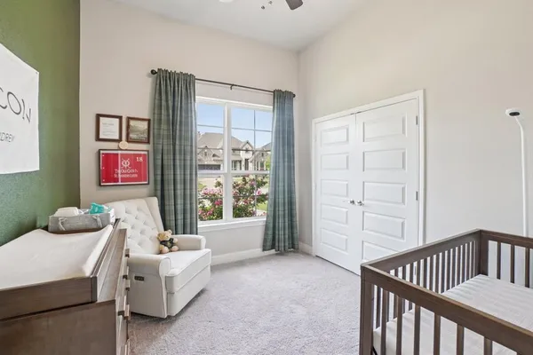 a bedroom with furniture and a window