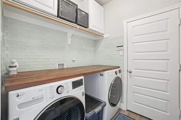 a utility room with dryer and washer