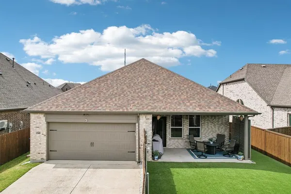 a front view of a house with sitting space and garden