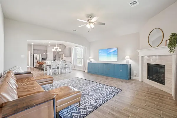 a living room with furniture and a fireplace