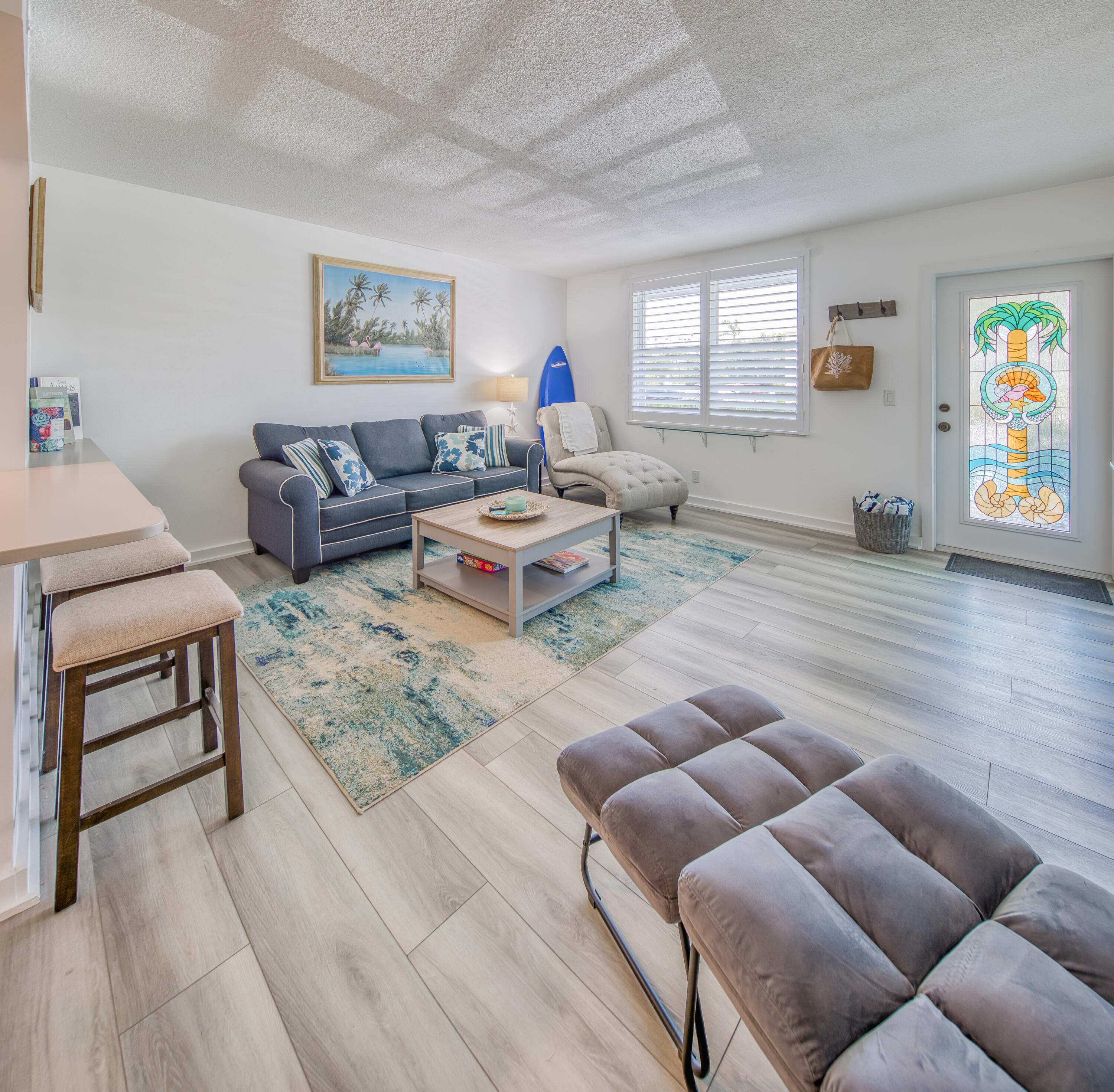 2565 South Ocean Boulevard, Unit 1040 (104) Palm Beach, FL 33480 - Photo 14 of 26 a living room with furniture a rug and a window