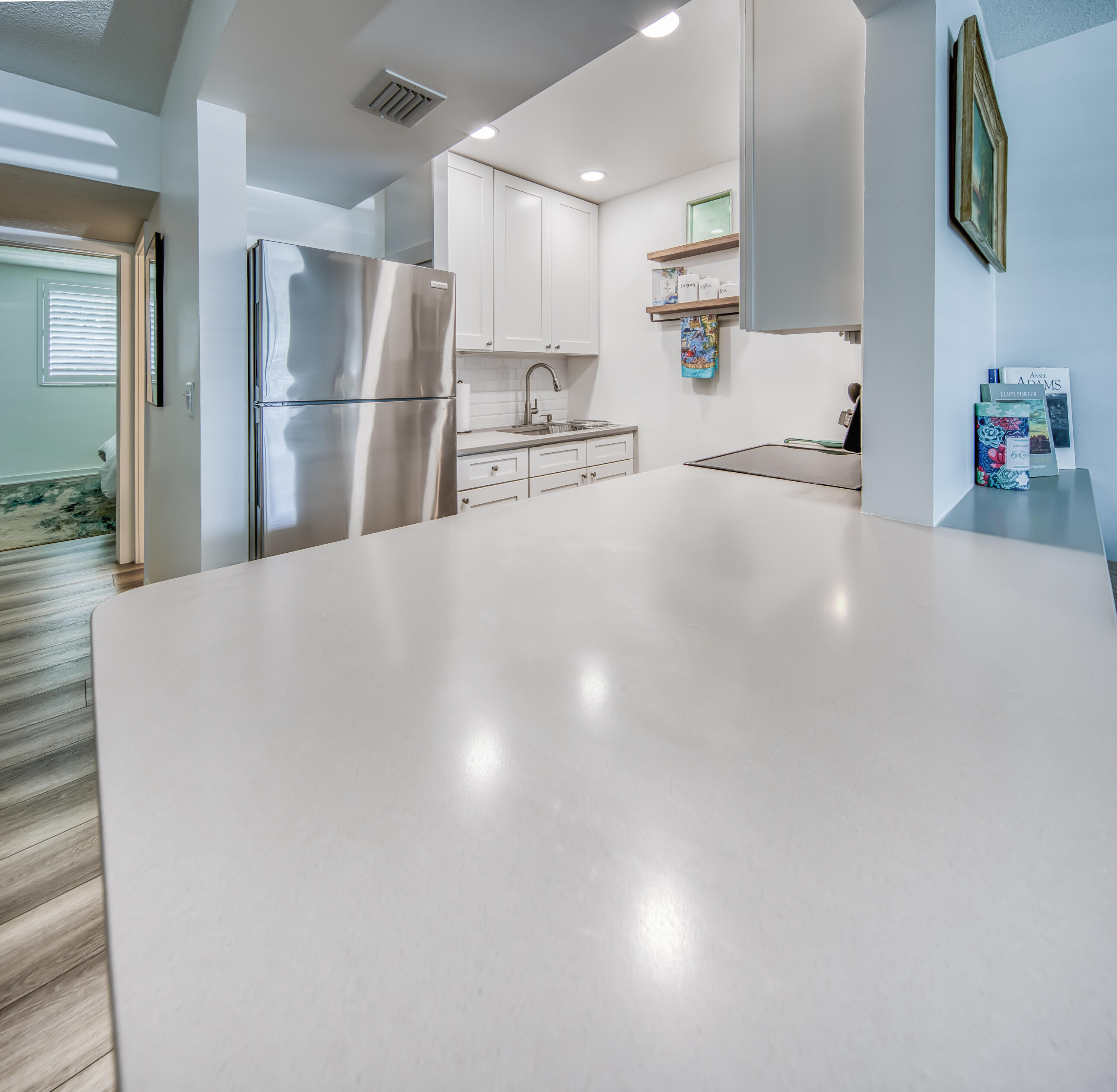 2565 South Ocean Boulevard, Unit 1040 (104) Palm Beach, FL 33480 - Photo 15 of 26 a view of a kitchen with refrigerator and cabinets