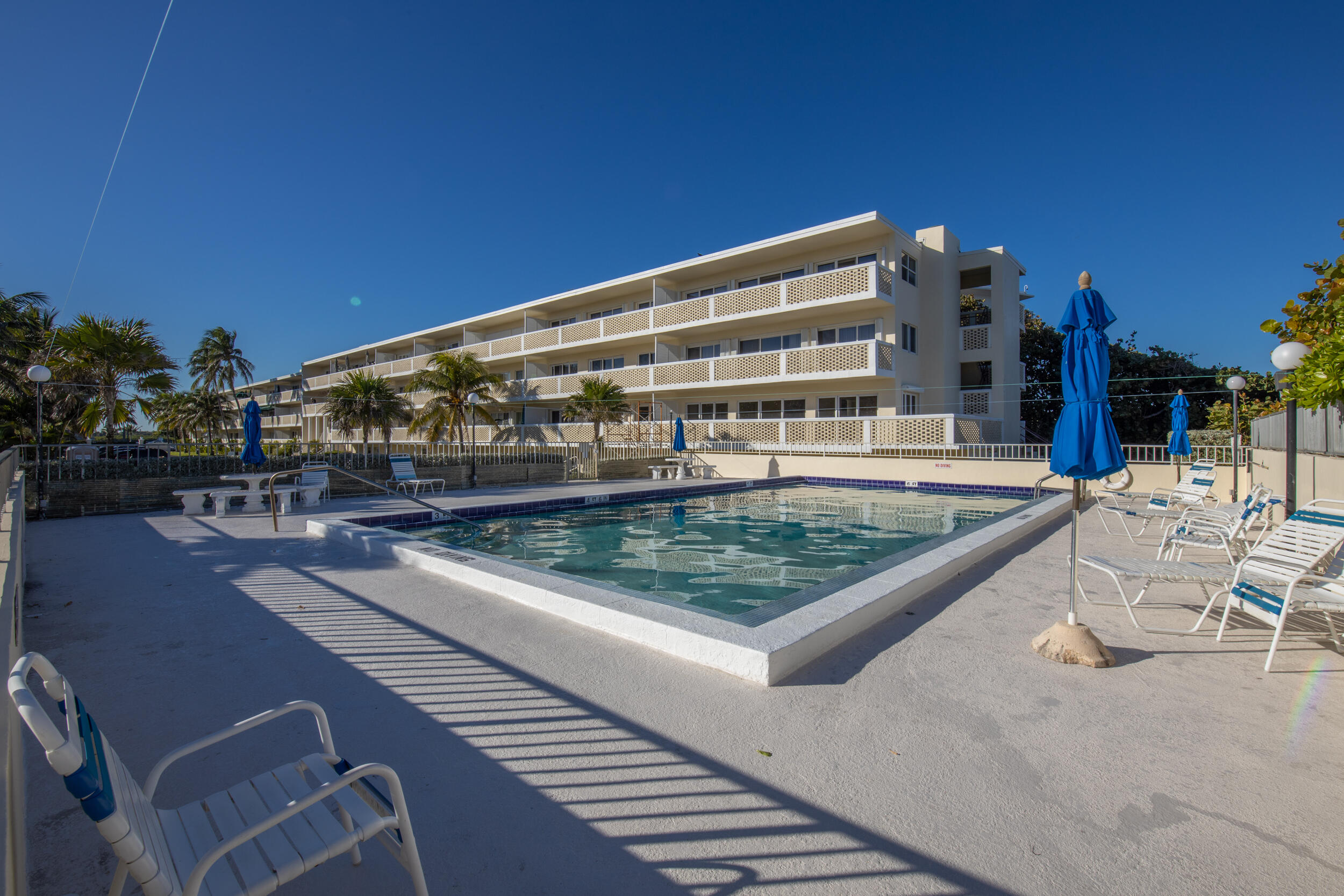 2565 South Ocean Boulevard, Unit 1040 (104) Palm Beach, FL 33480 - Photo 18 of 26 a view of a patio with chairs and a table