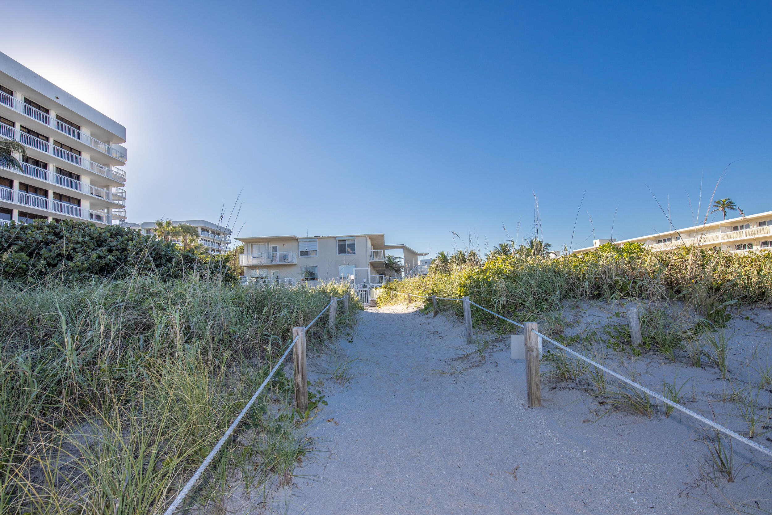 2565 South Ocean Boulevard, Unit 1040 (104) Palm Beach, FL 33480 - Photo 25 of 26 a view of a dry yard with wooden fence