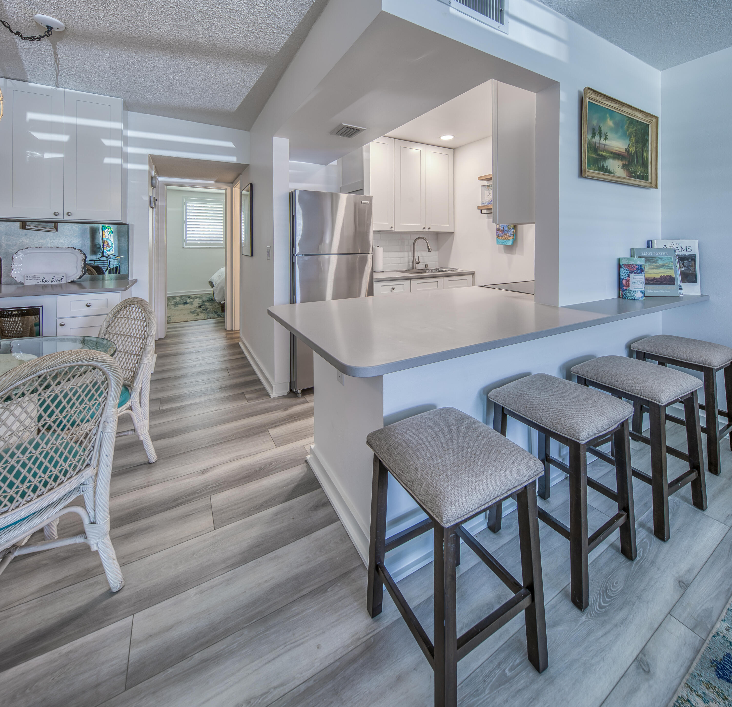 2565 South Ocean Boulevard, Unit 1040 (104) Palm Beach, FL 33480 - Photo 3 of 26 a view of a dining room with furniture