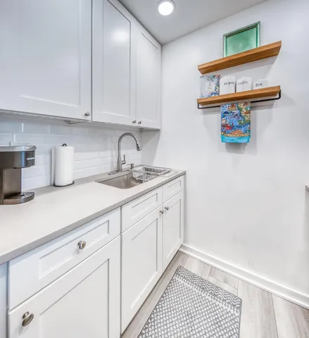 a kitchen with a sink and cabinets