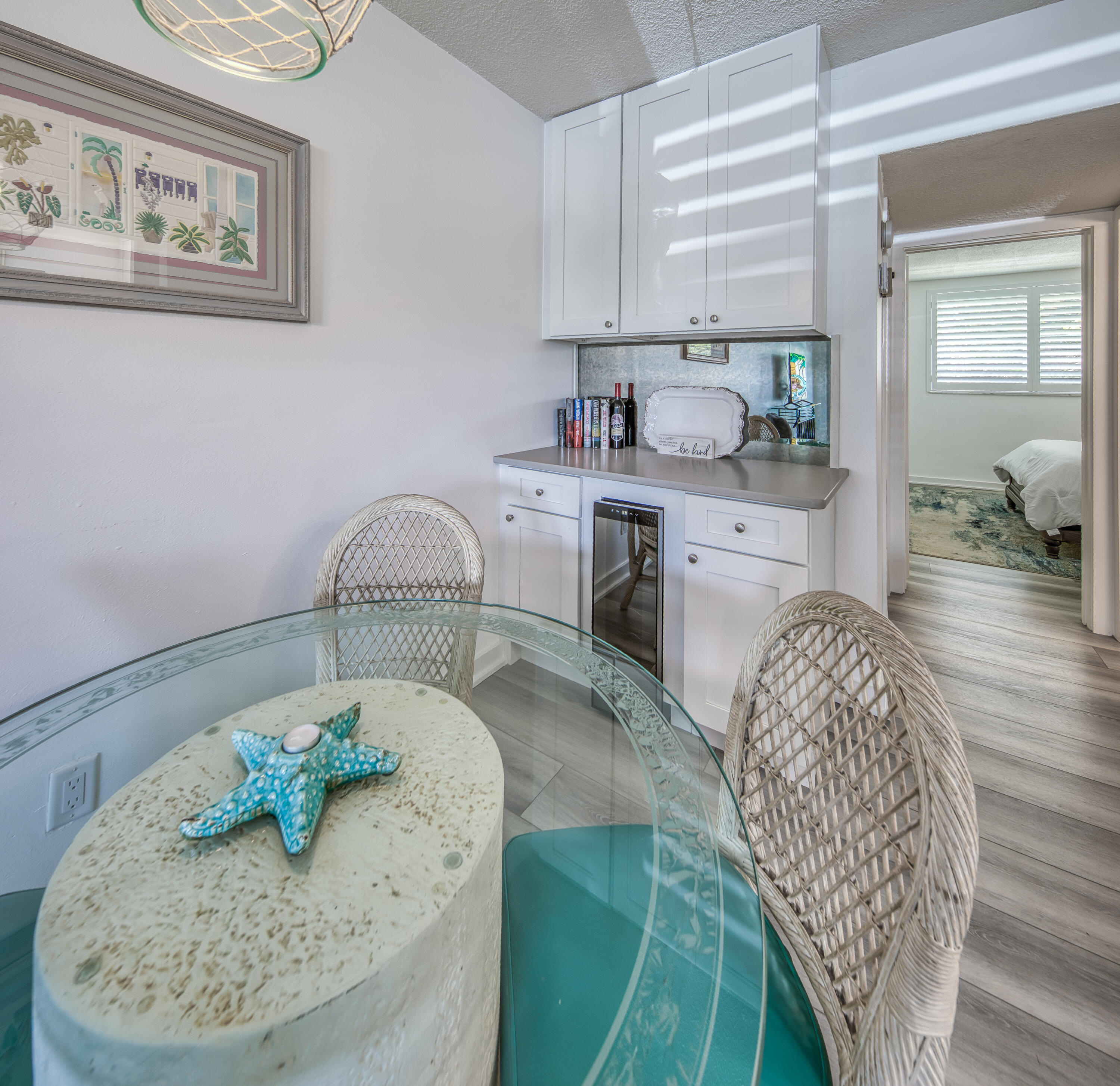2565 South Ocean Boulevard, Unit 1040 (104) Palm Beach, FL 33480 - Photo 10 of 26 a room with a sink and mirror
