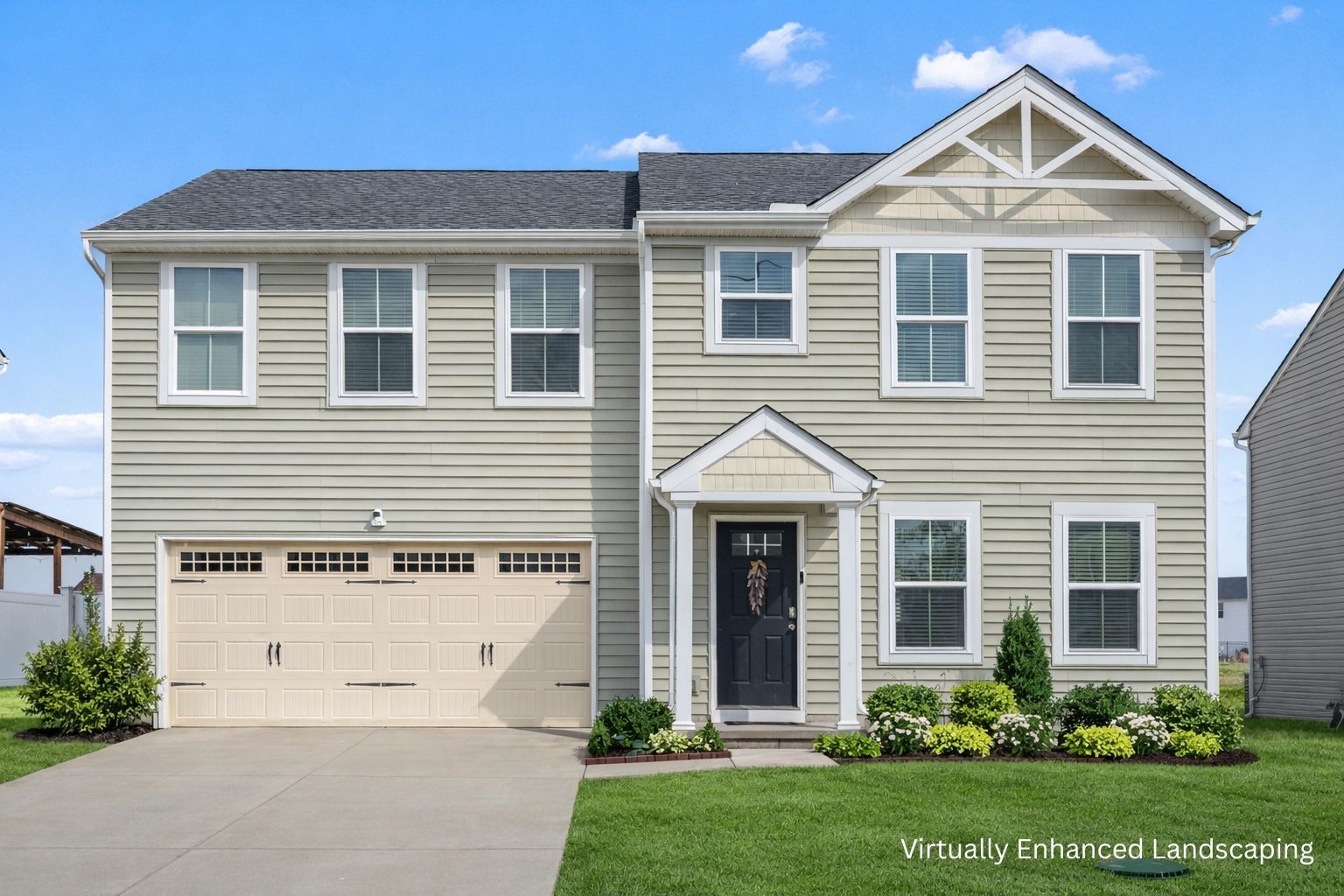 a view of a white house next to a yard