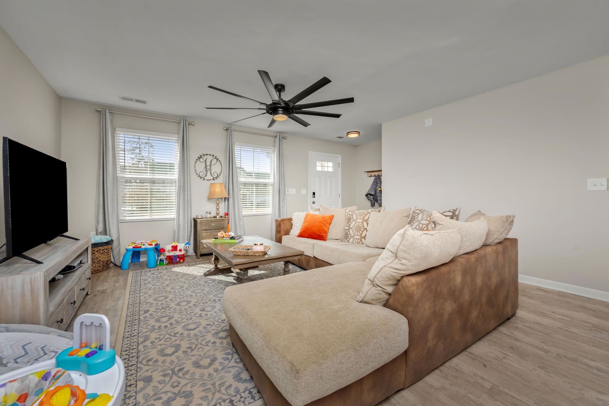 5571 Compass Way Christiana, TN 37037 - Photo 5 of 23 a living room with furniture and a flat screen tv