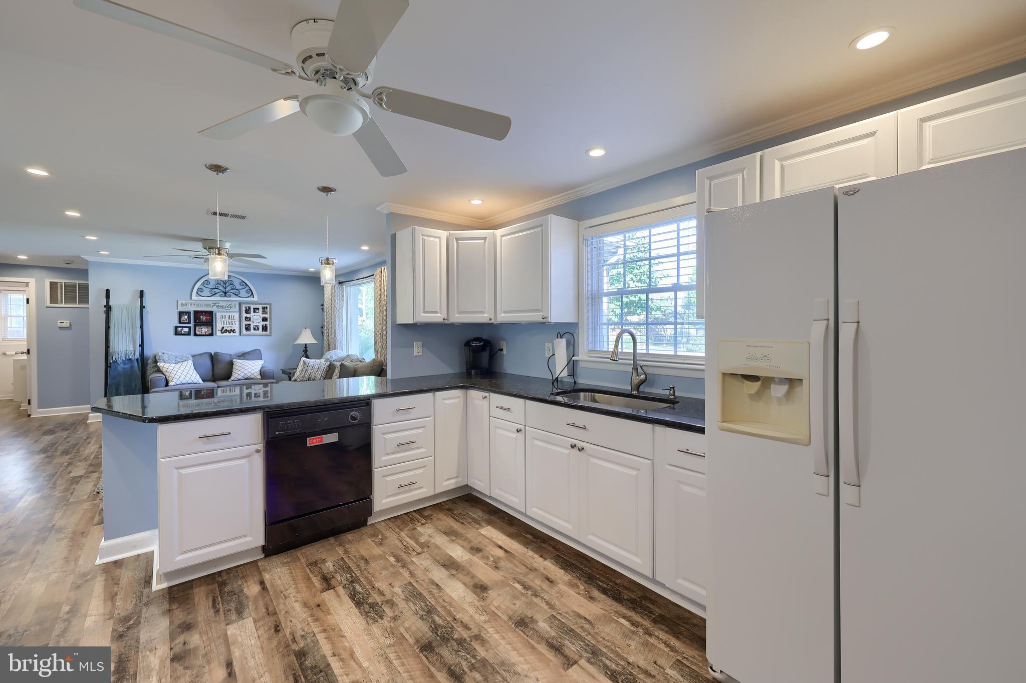 304 Edgehill Road York, PA 17403 - Photo 11 of 44 a large kitchen with stainless steel appliances granite countertop a refrigerator a sink dishwasher a stove with white cabinets